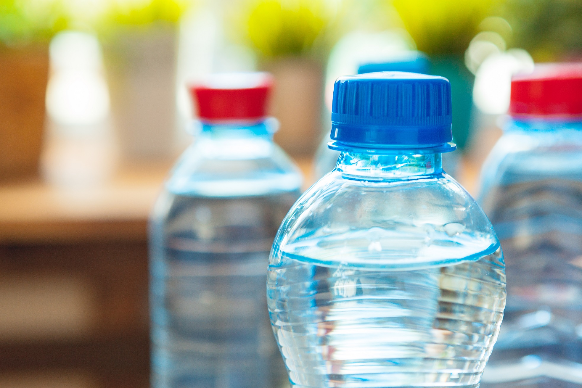 A group of neatly-arranged environmentally-friendly bottled water